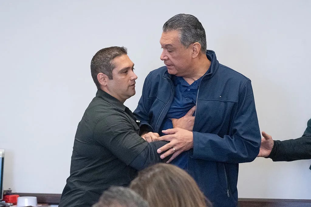 Los Angeles, CA - June 12:California Senator Alex Padilla is pushed out of the room as Homeland Security Secretary Kristi Noem holds a news conference in Los Angeles on Thursday, June 12, 2025.