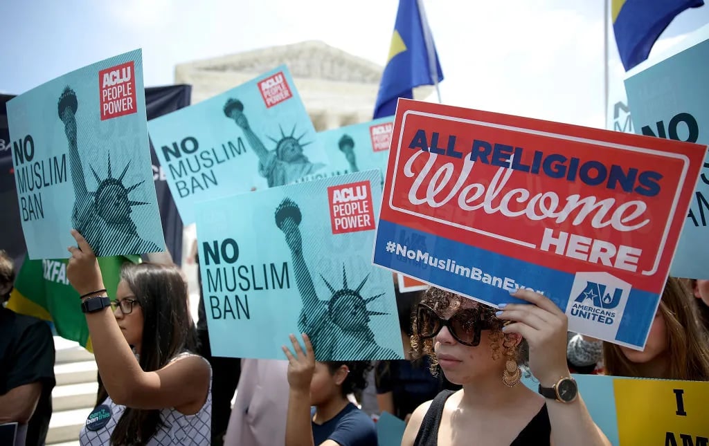 Protesters gather outside the U.S. Supreme Court as the court issued an immigration ruling June 26, 2018 in Washington, DC. The court issued a 5-4 ruling upholding the Trump administration's policy imposing limits on travel from several primarily Muslim nations