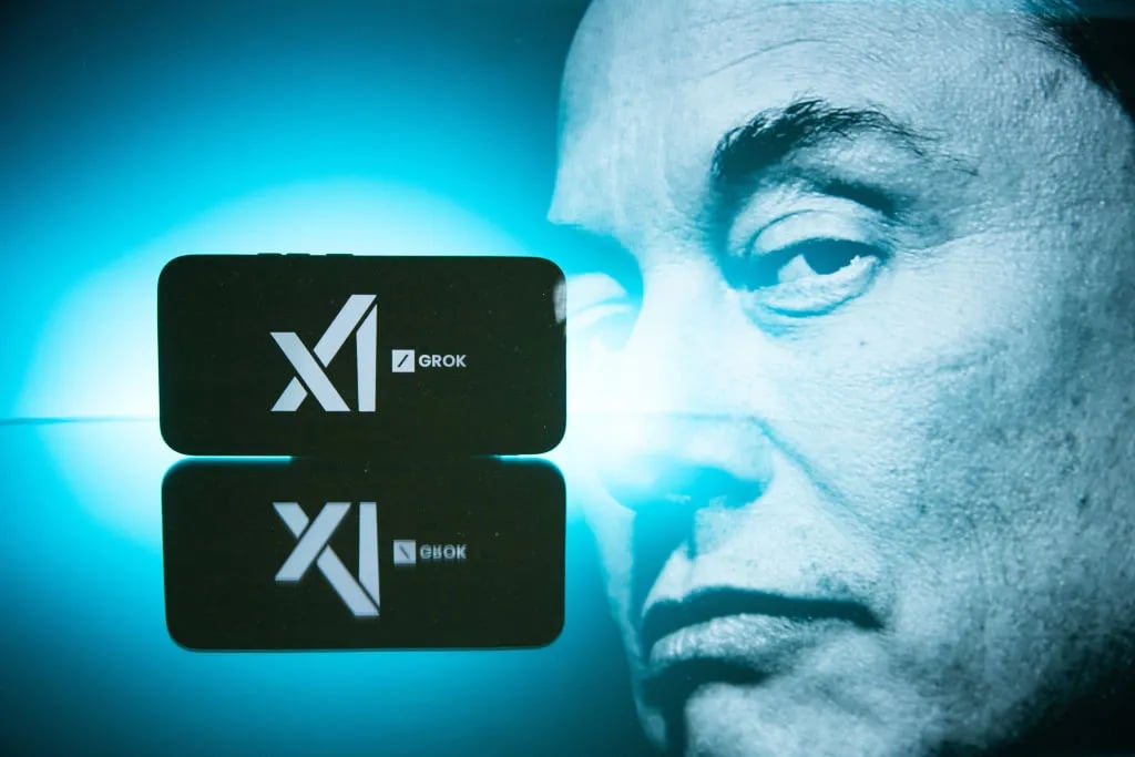 Double exposure photograph of a portrait of elon musk and a telephone displaying the grok artificial intelligence logo in Kerlouan in Brittany in France on February 18 2025. (Photo by Vincent Feuray / Hans Lucas / Hans Lucas via AFP)
