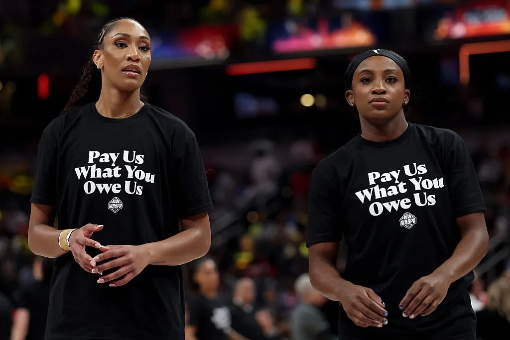 WNBA Players Make A Strong Statement At All-Star Game With 'Pay Us What You Owe Us' Shirts