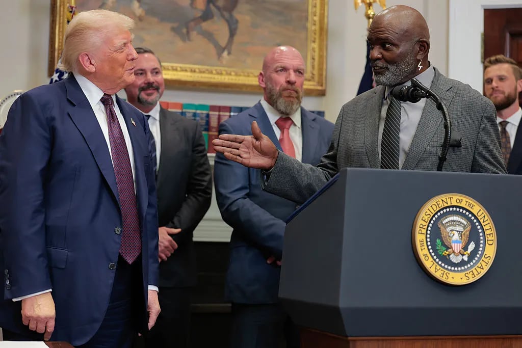 WASHINGTON, DC - JULY 31: U.S. President Donald Trump listens as former New York Giants linebacker Lawrence Taylor speaks during an executive order signing ceremony in the Roosevelt Room of the White House on July 31, 2025 in Washington, DC. Trump signed a series of orders that will expand on his council on sports, fitness and nutrition, including by reviving the Presidential Fitness Test in public schools.
