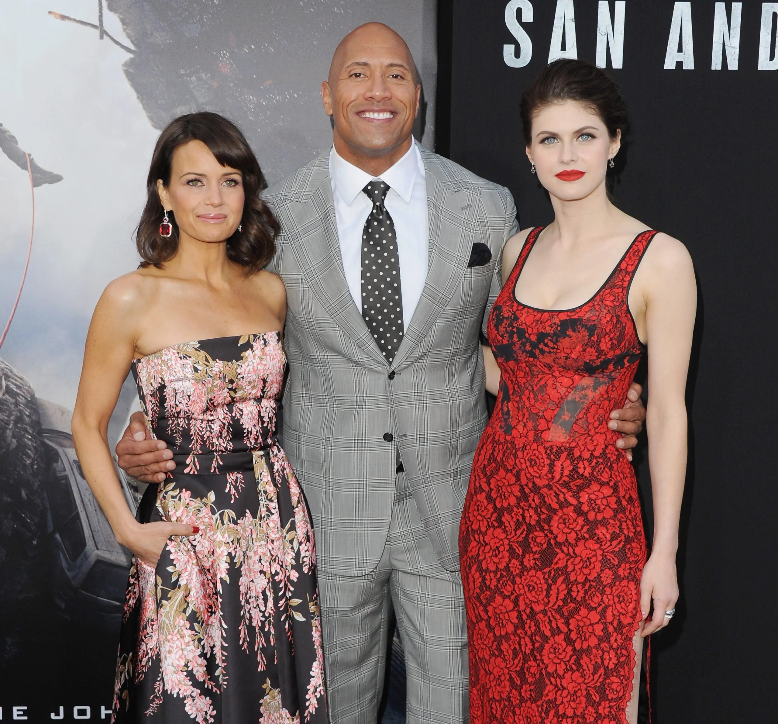 Actress Carla Gugino, Dwayne "The Rock" Johnson and actress Alexandra Daddario arrive at the Premiere Of Warner Bros. Pictures' "San Andreas" at TCL Chinese Theatre on May 26, 2015 in Hollywood, California.