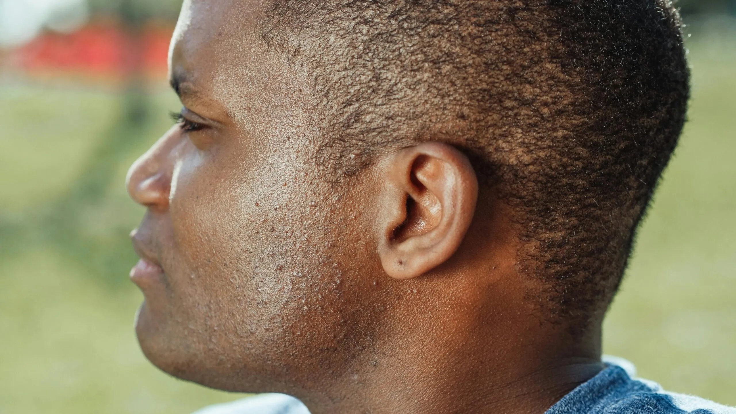 Close-up of a Black man's ear from the side