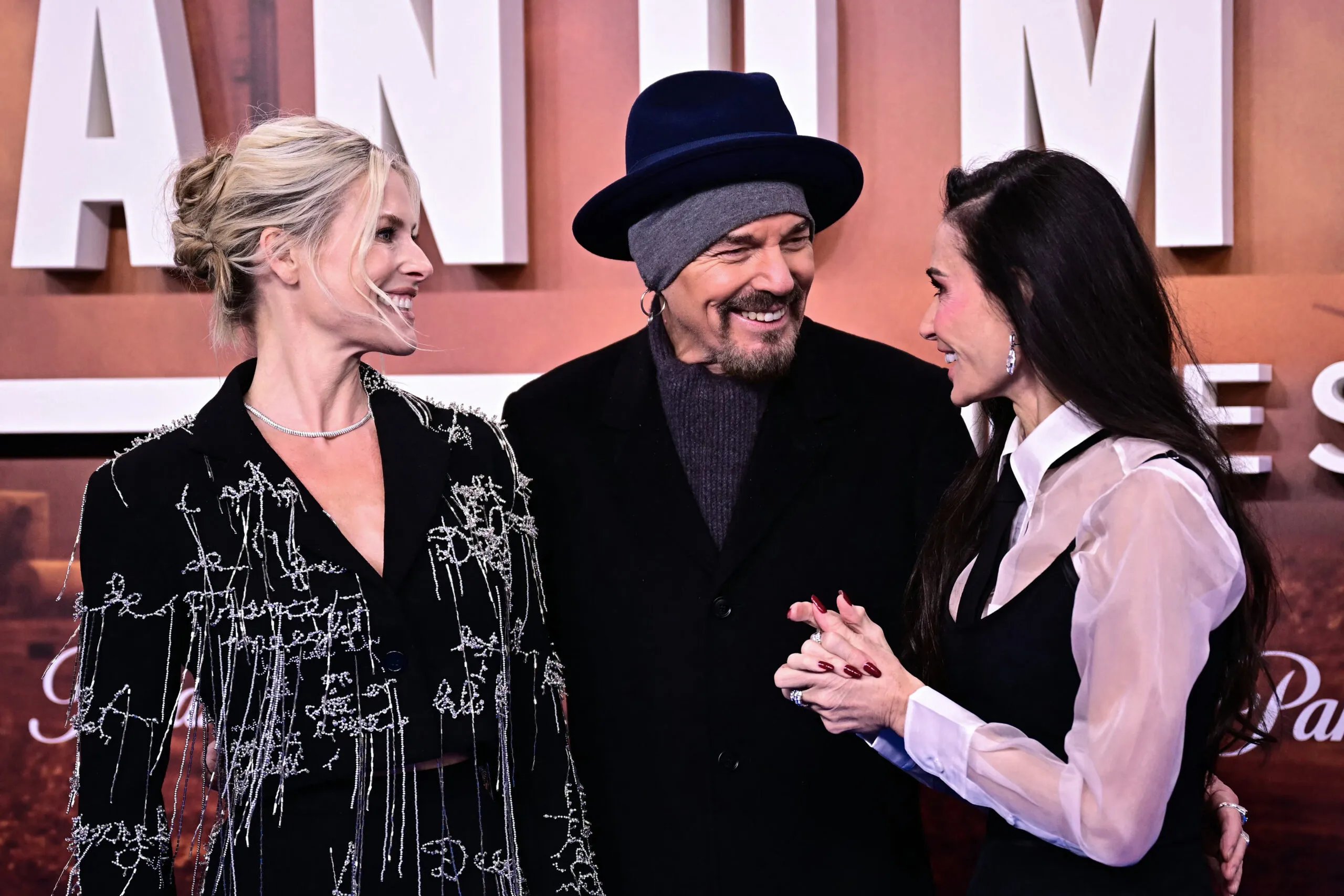 US actress Demi Moore (R), US actress Ali Larter and US actor Billy Bob Thornton (C) arrive on November 14, 2025 on the red carpet for the European Premiere of the second season of the US drama television series "Landman" at the Zoo Palast cinema in Berlin.