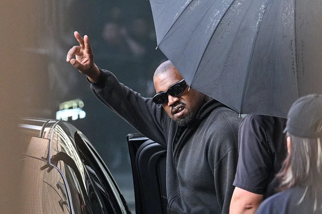 TOPSHOT - US rapper and producer Kanye West gestures upon arriving at Shanghai Pudong International Airport on July 11, 2025. Kanye West will hold a concert in Shanghai on July 12.