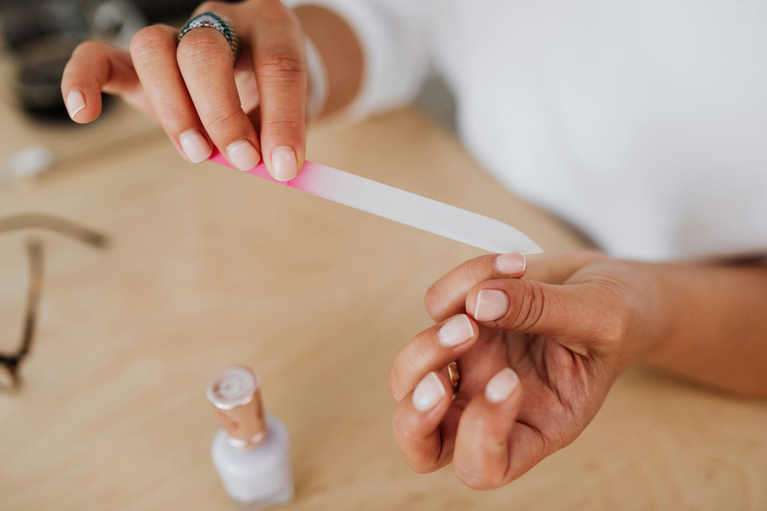 Black woman filing her nails. nail-microchip-cards