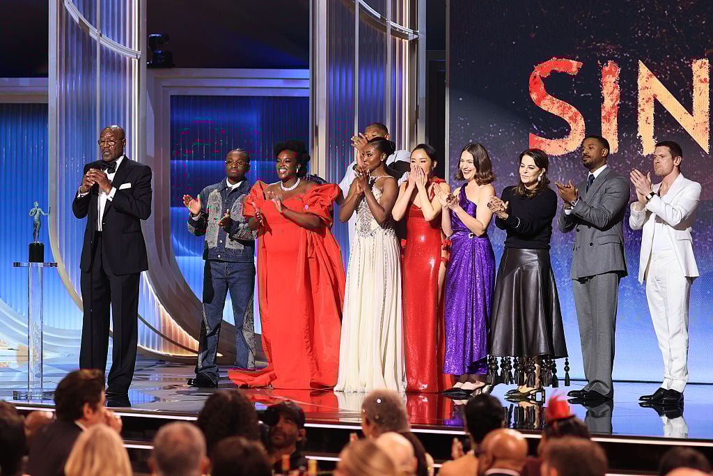 LOS ANGELES, CALIFORNIA - MARCH 01: (L-R) Delroy Lindo, Miles Caton, Wunmi Mosaku, Jayme Lawson, Omar Benson Miller, Li Jun Li, Lola Kirke, Francine Maisler, Michael B. Jordan, and Jack O'Connell accept the Outstanding Performance by a Cast in a Motion Picture Award for "Sinners" onstage during the 32nd Annual Actor Awards at Shrine Auditorium and Expo Hall on March 01, 2026 in Los Angeles, California. 