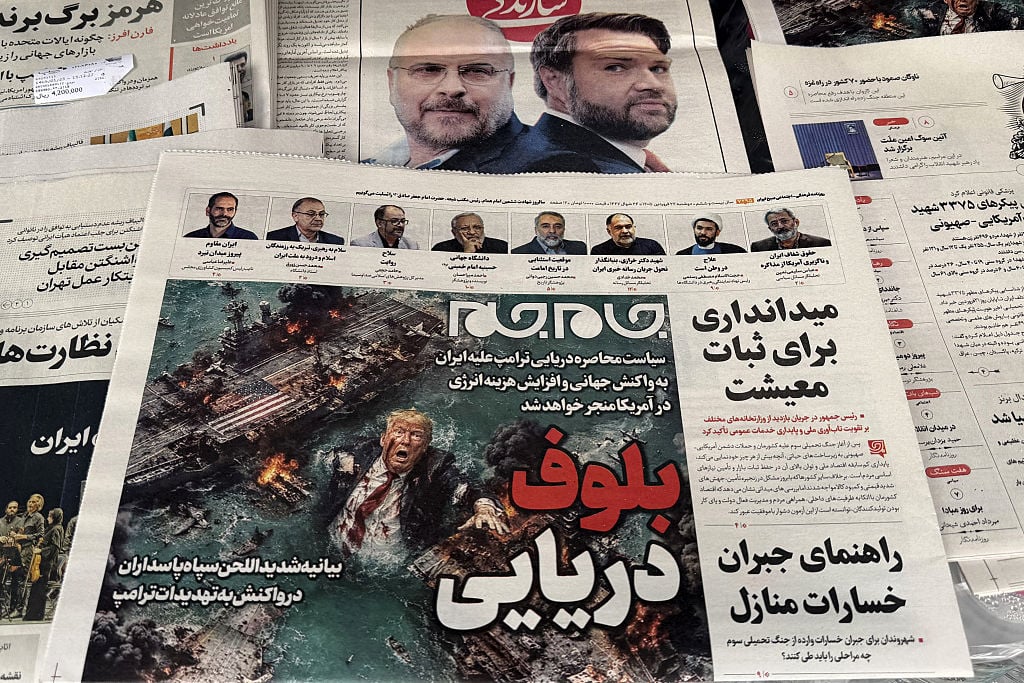 The front page of the Jam Jam newspaper on sale at a newsstand features a cartoon of US President Donald Trump drowning in the Strait of Hormuz with the headline "Marine Bluff" in Tehran on April 13, 2026. The failure of US-Iran peace talks has left the US President with several unpalatable options, as analysts say his order to blockade the strategic Strait of Hormuz could further complicate his next move on April 12, 2026. Any hopes that US Vice President would emerge from the marathon day of negotiations with top Iranian officials with a deal to end a war that has rippled across the Middle East were dashed when he left hosts Pakistan emptyhanded.