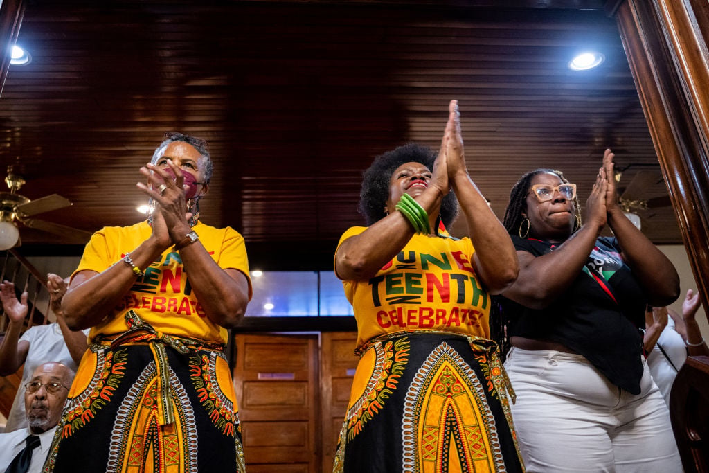 People participate in a service at the Reedy Chapel A.M.E. Church on June 19, 2022 in Galveston, Texas. Galveston island is the birthplace of Juneteenth, the oldest known nationally celebrated event commemorating the end of slavery in the United States. President Abraham Lincoln's Emancipation Proclamation stated that as of January 1, 1863, all enslaved people in the U.S. should be set free, but it was not until 2 years later, in 1865, that Galveston island gained its freedom. After years of Juneteenth not being recognized as a holiday, on June 19, 2019, New Hampshire Gov. Chris Sununu signed a bill officially recognizing Juneteenth as a state holiday. The decision was later followed by President Joe Biden's signing of the Juneteenth National Independence Day act, making it the first federal holiday since Martin Luther King, Jr. Day. 