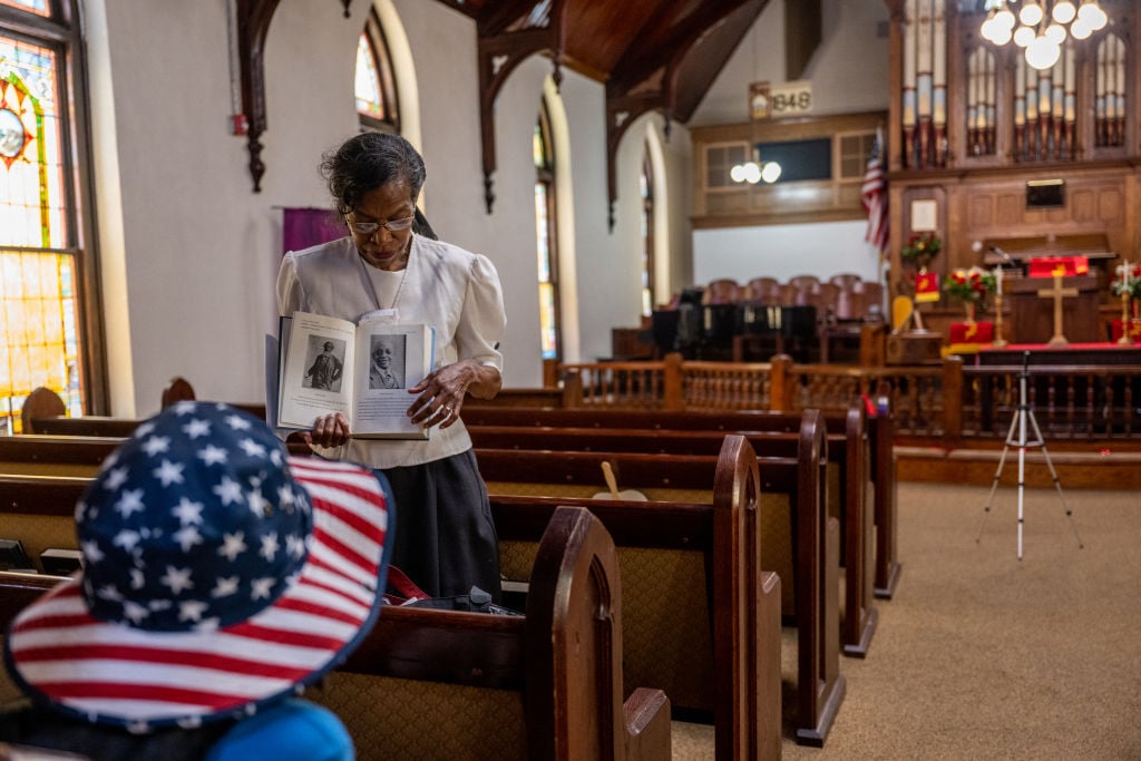 GALVESTON, TEXAS - JUNE 19: A child listens during a tour at the Reedy Chapel A.M.E. Church on June 19, 2022 in Galveston, Texas. Galveston island is the birthplace of Juneteenth, the oldest known nationally celebrated event commemorating the end of slavery in the United States. President Abraham Lincoln's Emancipation Proclamation stated that as of January 1, 1863, all enslaved people in the U.S. should be set free, but it was not until 2 years later, in 1865, that Galveston island gained its freedom. After years of Juneteenth not being recognized as a holiday, on June 19, 2019, New Hampshire Gov. Chris Sununu signed a bill officially recognizing Juneteenth as a state holiday. The decision was later followed by President Joe Biden's signing of the Juneteenth National Independence Day act, making it the first federal holiday since Martin Luther King, Jr. Day.