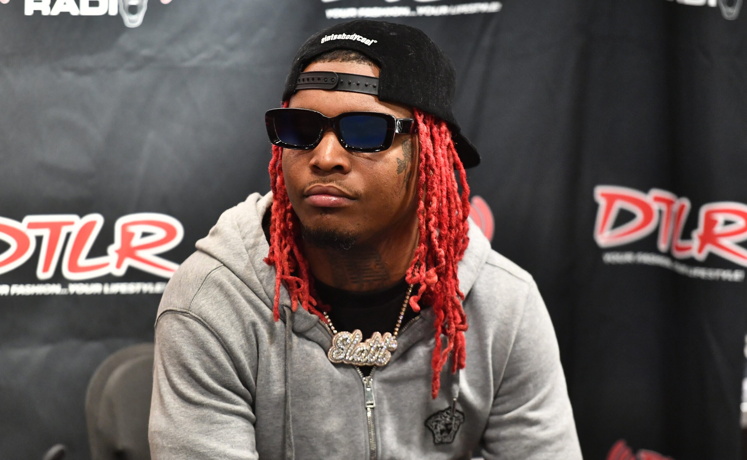 Rapper Lil Keed attends Young Stoner Life Meet &amp; Greet at DTLR Camp Creek on April 22, 2021 in East Point, Georgia.
