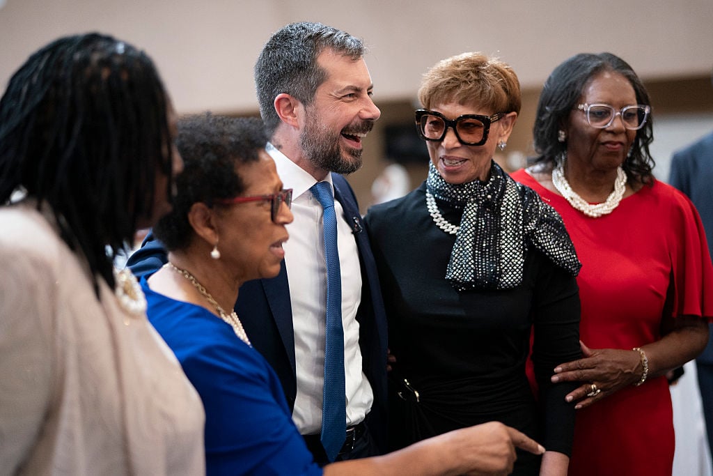 Former U.S. Transportation Secretary Pete Buttigieg shares a laugh during an NAACP fundraiser at Edisto Fork United Methodist Church on August 22, 2026 in Orangeburg, South Carolina. South Carolina will hold the first Democratic primary in the next presidential election, making the Palmetto State a strategic stop for potential candidates like Buttigieg.