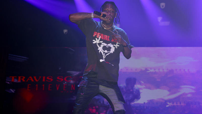 Travis Scott Stops Concert And Tells Rowdy Fans Dangling From Truss To Get Down