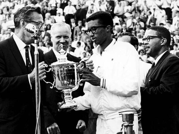 Arthur Ashe receiving his championship trophy at the US Open in 1968