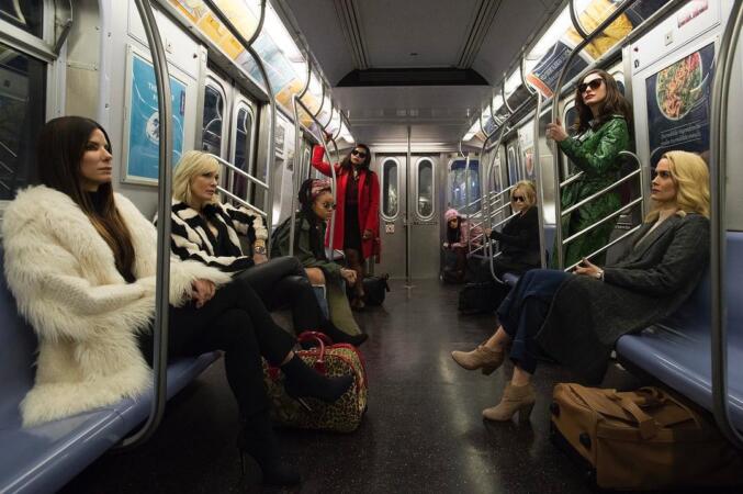 "Oceans 8" (L-R): Debbie Ocean (Sandra Bullock) attempts to pull off the heist of the century at New York City’s star-studded annual Met Gala. Her first stop is to assemble the perfect crew: Lou (Cate Blanchett); Nine Ball (Rihanna); Amita (Mindy Kaling); Constance (Awkwafina); Rose (Helena Bonham Carter); Daphne Kluger (Anne Hathaway); and Tammy (Sarah Paulson). Photo by Barry Wetcher | Warner Bros. Pictures and Village Roadshow Pictures