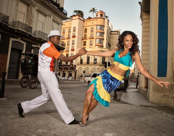 Indira Mora and Lazaro David Ramírez Junco of dance company Rakatan dance Salsa in a little side street close to Prado in Havana, Cuba, on May 6, 2015.