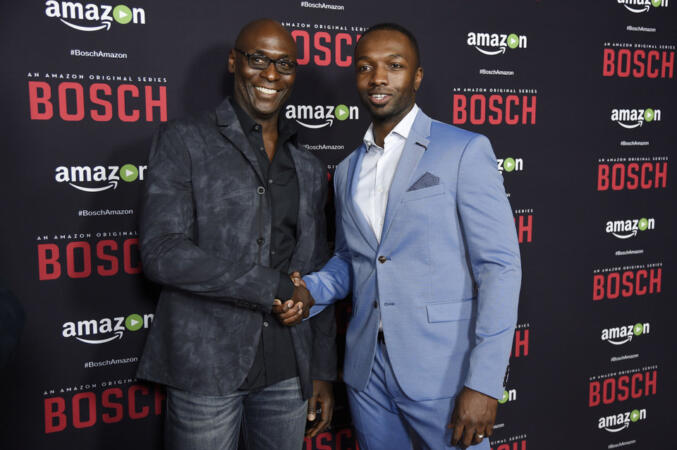 Lance Reddick, left, and Jamie Hector, cast members in "Bosch," pose together at the season two premiere of the Amazon original series at the Pacific Design Center on Thursday, March 3, 2016, in West Hollywood, Calif. Reddick and Hector previously worked together as cast members on the television series "The Wire." (Photo by Chris Pizzello/Invision/AP)