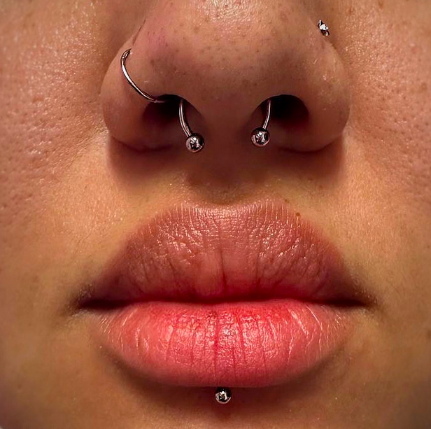Orbital piercing of septum and nostril area.