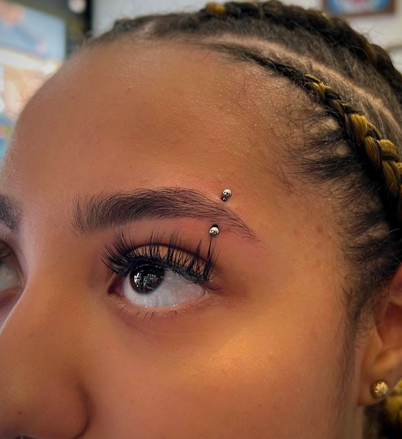 Orbital piercing over eyelid.