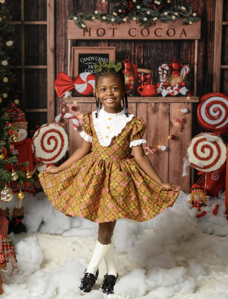 A little girl in a vintage dress