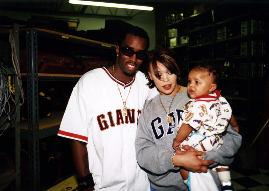 Faith Evans 90s pictured: Diddy, Faith Evans, and Christopher Wallace Jr. pose together
