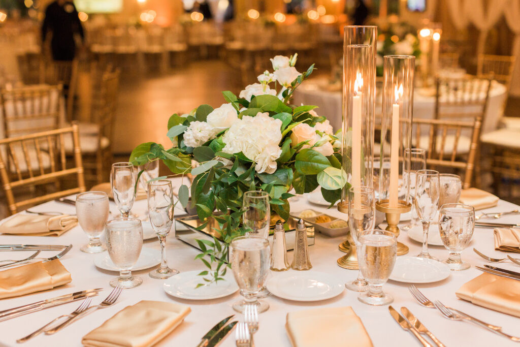 A floral arrangement on a dinner table