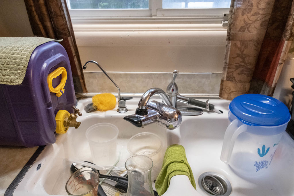 A water storage container used by Cleophus Mooney and his family for clean drinking water in his home in Flint, Michigan