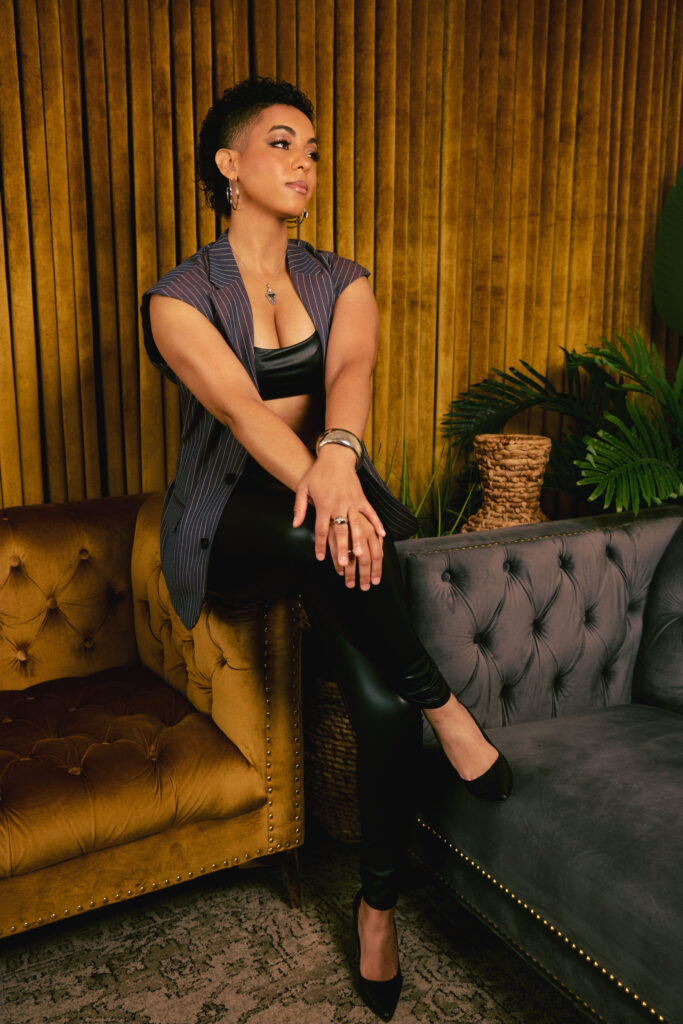 A woman posing on a couch