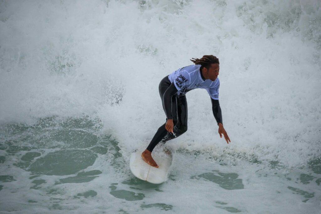 Black man surfing