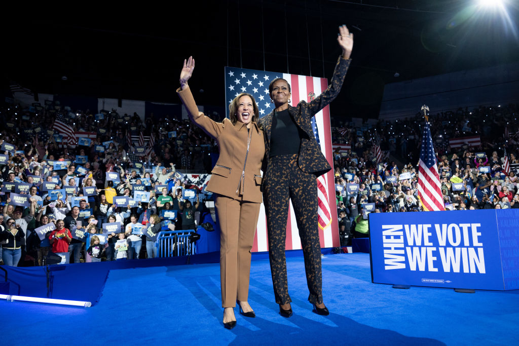 Democratic presidential nominee, U.S. Vice President Kamala Harris greets former first lady Michelle Obama during a campaign rally at the Wings Event Center on October 26, 2024 in Kalamazoo, Michigan. Vice President Harris will be campaigning today with former U.S. First Lady Michelle Obama in the battleground swing state of Michigan. With 10 days remaining, Harris continues campaigning against Republican presidential nominee, former U.S. President Donald Trump ahead of the November 5 election. 