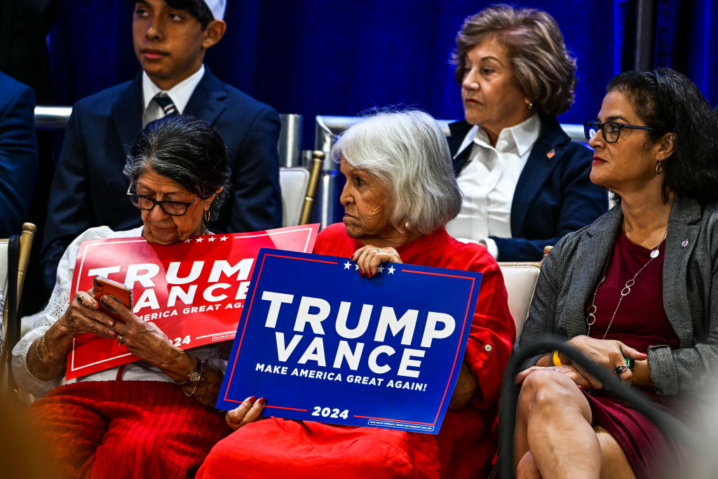 Supporters of Former US President and 2024 Republican presidential candidate Donald Trump attend a roundtable discussion with Latino community leaders at Trump National Doral Miami resort in Miami, Florida on October 22, 2024 |