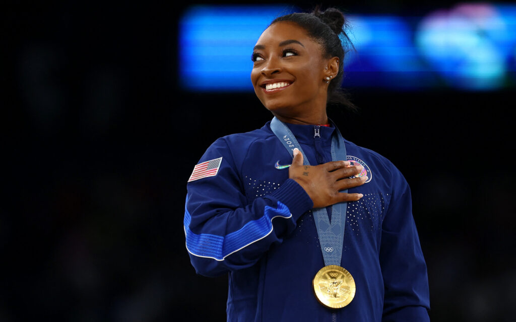 Paris 2024 Olympics - Artistic Gymnastics - Women's Vault Victory Ceremony - Bercy Arena, Paris, France - August 03, 2024. Gold medallist Simone Biles of United States celebrates on the podium