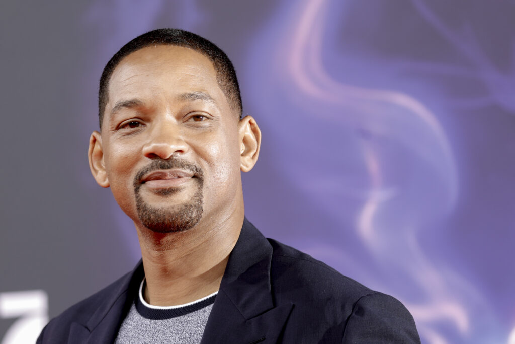 Will Smith smiles and looks into the distance while attending the movie premiere of "Aladdin" at UCI Luxe Mercedes Platz on May 11, 2019 in Berlin, Germany.