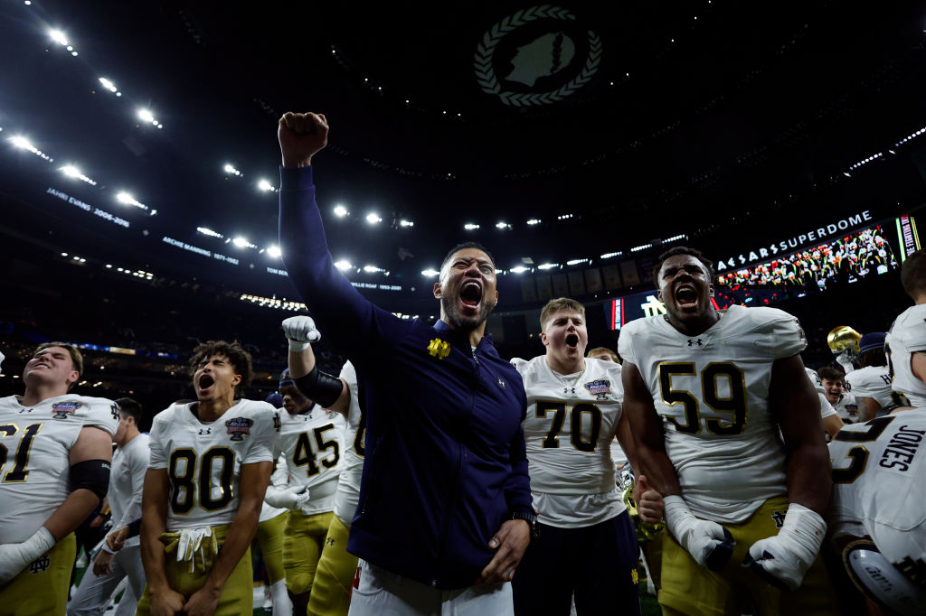  Head coach Marcus Freeman of the Notre Dame Fighting Irish celebrates with his team after a 23-10 victory against the Georgia Bulldogs in the 91st Allstate Sugar Bowl at Caesars Superdome on January 02, 2025 in New Orleans, Louisiana.