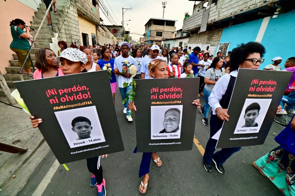 Relatives of the four Ecuadorian teenagers apprehended by soldiers and found dead near a military base, attend a march a month after their apprehension in Guayaquil, Ecuador on January 8, 2025.