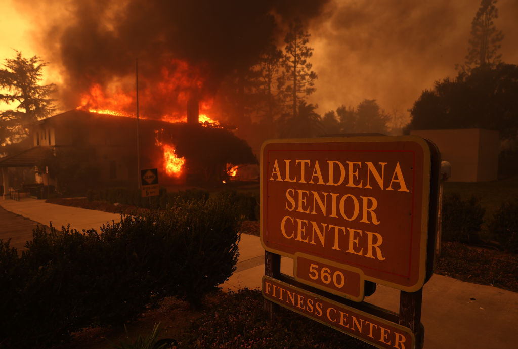 ALTADENA, CALIFORNIA - JANUARY 08: The Altadena Senior Center burns as the Eaton Fire moves through the area on January 08, 2025 in Altadena, California. Fueled by intense Santa Ana Winds, the Eaton Fire has grown to over 10,000 acres and has destroyed many homes and businesses.