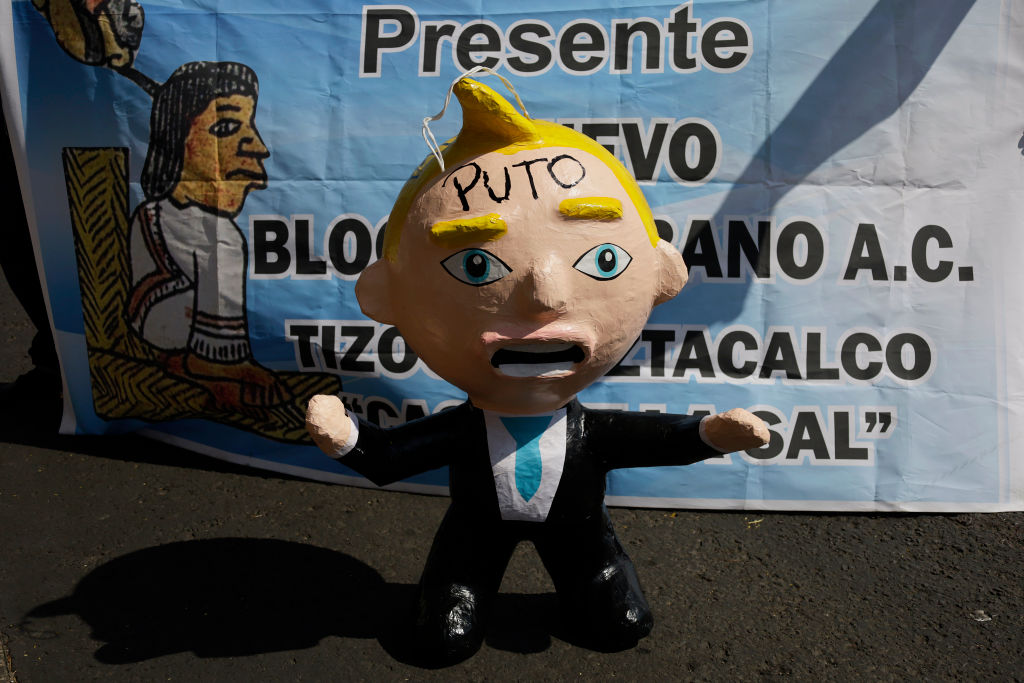 Mexicans and migrants demonstrate with a pinata outside the US Embassy in Mexico City, Mexico, on January 20, 2025, against the inauguration of Donald Trump as president of the United States