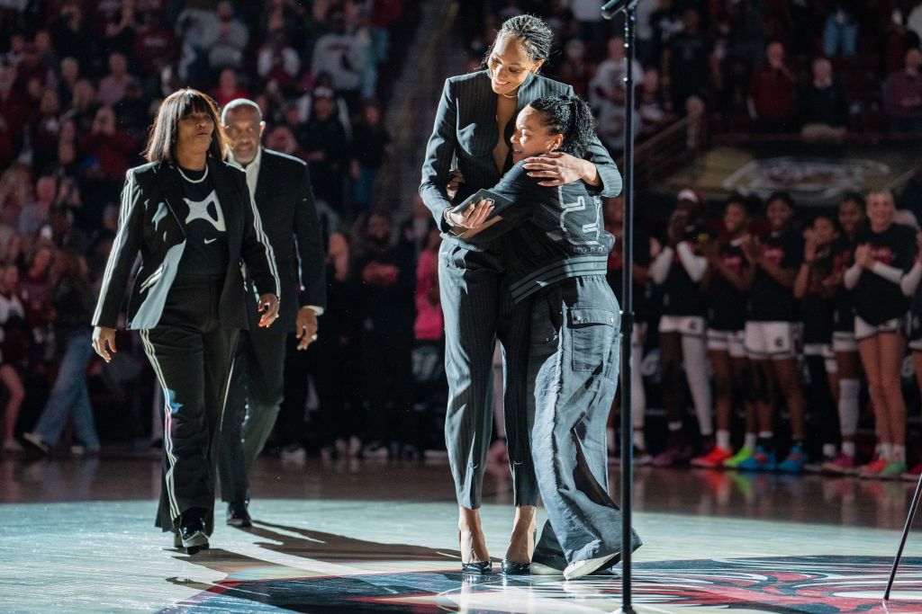 COLUMBIA, SOUTH CAROLINA - FEBRUARY 02: Former South Carolina Gamecocks player A'ja Wilson hugs head coach Dawn Staley of the South Carolina Gamecocks before her jersey retirement ceremony before the game against the Auburn Tigers at Colonial Life Arena on February 02, 2025 in Columbia, South Carolina.  