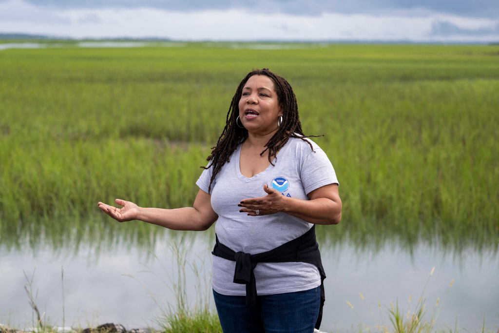 Dionne Hoskins-Brown, Chair of the Gullah Geechee Cultural Heritage Corridor Commission, speaks at Station Creek Landing in St Helena, South Carolina, on July 10, 2023. Isolated on islands scattered along the coast, ancestors of those in the Gullah Geechee community relied on the land and sea. They created their own culture, fed by their African heritage, and even developed their own Creole language. Hundreds of thousands of people are today part of the community -- which is threatened by climate change, gentrification, and real estate developers circling like hawks.