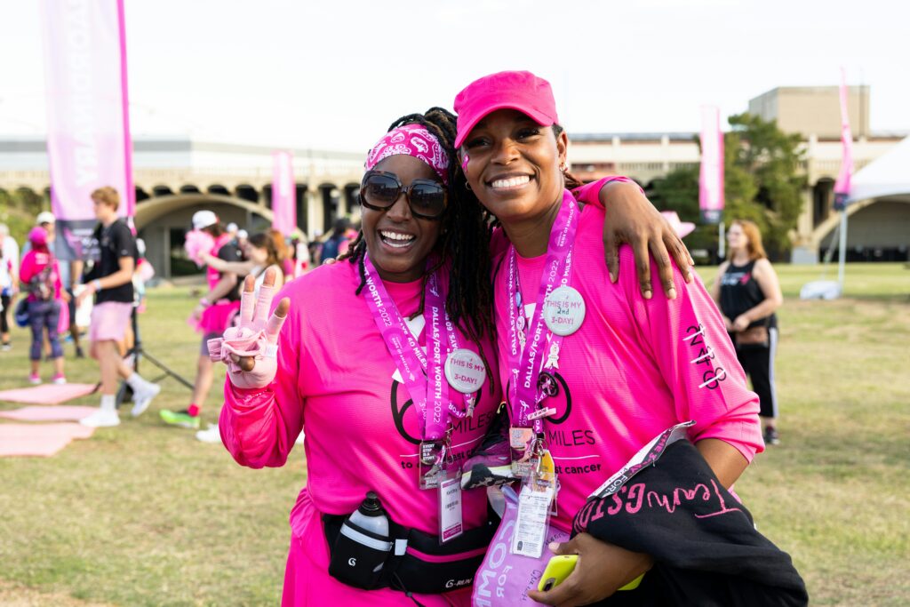 breast cancer pictured: Black women smiling during breast cancer awareness walk