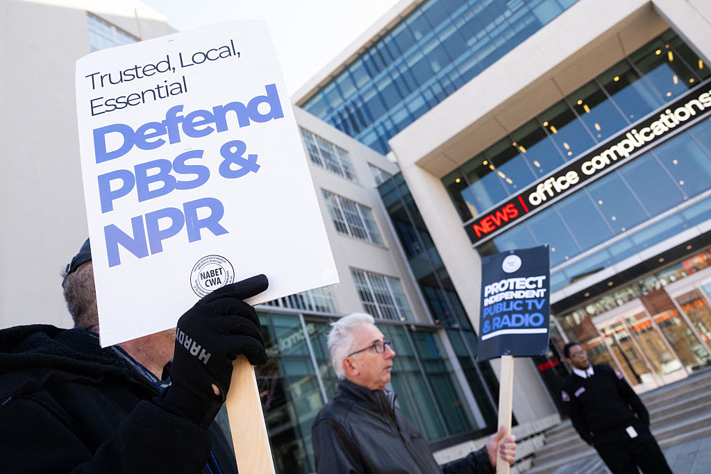 People participate in a rally to call on Congress to protect funding for US public broadcasters, Public Broadcasting Service (PBS) and National Public Radio (NPR), outside the NPR headquarters in Washington, DC, on March 26, 2025. President Donald Trump said on March 25 that he would "love" to cut funding for the US public broadcasters, which reportedly will be reviewed by Elon Musk's Department of Government Efficiency this week.