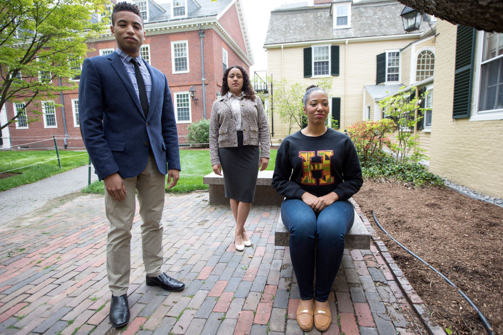 CAMBRIDGE, MA - MAY 8: From left, Harvard graduate students Michael Huggins, Courtney Woods, and Jillian M. Simons pose for a portrait on the campus of the university in Cambridge, MA on May 8, 2017. The graduate students will take part in a Harvard Black Commencement Ceremony.