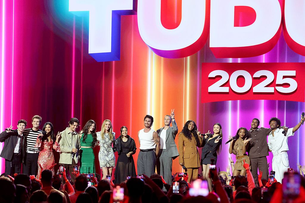 Ashby Gentry, Noah Lalonde, Nikki Rodriguez, Felix Mallard, Sara Waisglass, Brianne Howey, Antonia Gentry, Chase Stokes, Drew Starkey, Carlacia Grant, Madison Bailey, Lovie Simone, Michael Cooper Jr. and Jonathan Daviss speak onstage during NETFLIX TUDUM 2025: THE LIVE EVENT at The Kia Forum on May 31, 2025 in Inglewood, California