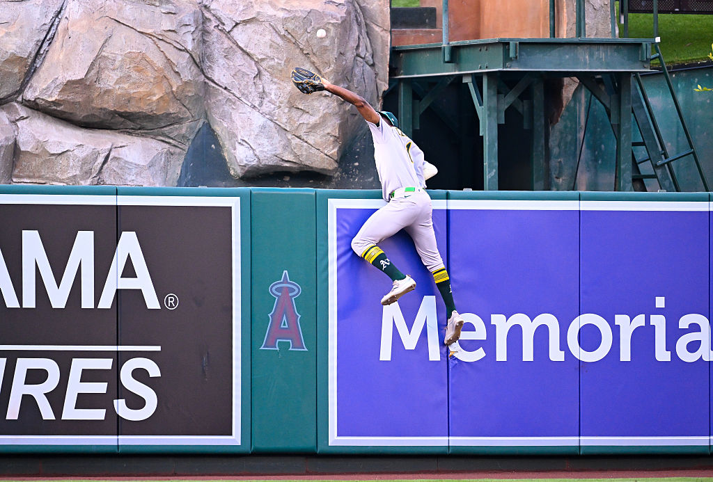 ANAHEIM, CALIFORNIA - JUNE 09: Denzel Clarke #1 of the Athletics catches a fly ball in the bottom of the first inning during the game between Athletics and Los Angeles Angels at Angel Stadium of Anaheim on June 09, 2025 in Anaheim, California.