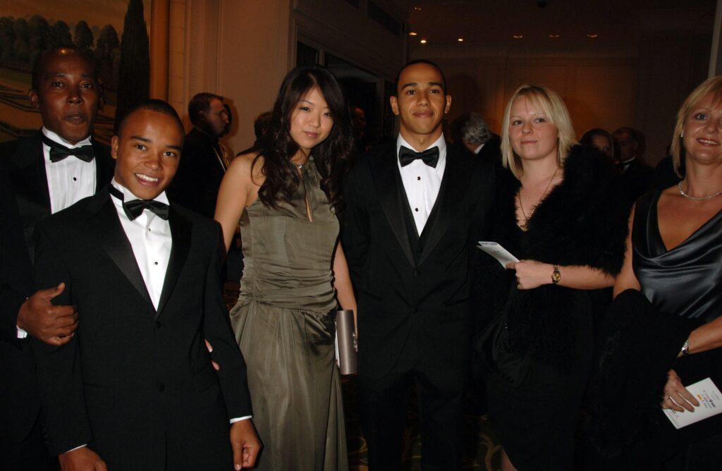 Lewis Hamilton poses with his girlfriend Jodia Ma (3rd,L), his father Anthony Hamilton (L), his brother Nicholas Hamilton (2nd,L) at the AutoSport Magazine awards at the Grovesnor House Hotel on December 3, 2006 in London, England.
