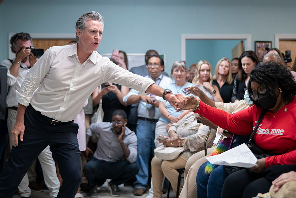CAMDEN, SOUTH CAROLINA - JULY 8: California Gov. Gavin Newsom reaches out to an attendee at the Kershaw County Center on Aging on July 8, 2025 in Camden, South Carolina. The governor is on the first of a two-day tour of rural counties in South Carolina, hosted by the state Democratic Party.