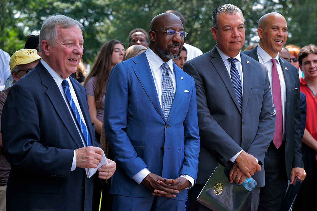 WASHINGTON, DC - JULY 29: Senate Democrats, (L-R) Sen. Richard Durbin (D-IL), Sen. Raphael Warnock (D-GA), Sen. Alex Padilla (D-CA) and Sen. Cory Booker (D-NJ) join unions, civil rights and voting rights advocates for a rally to reintroduce the John R. Lewis Voting Rights Advancement Act outside the U.S. Capitol on July 29, 2025 in Washington, DC. Sixty years after the late Rep. John Lewis (D-GA) was violently attacked crossing the Edmund Pettus Bridge in Selma, Alabama, the legislation that bears his name would restore and strengthen parts of the Voting Rights Act of 1965, including the requirement for states and jurisdictions with a history of voting rights violations to seek federal approval before enacting certain changes to their voting laws.