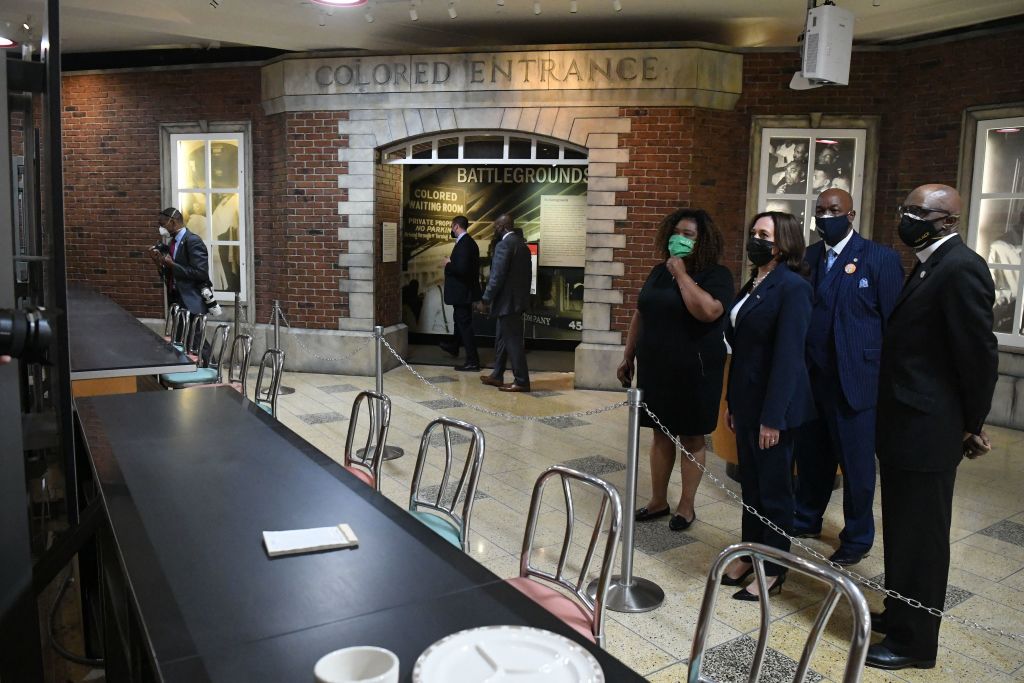 US Vice President Kamala Harris looks at a segregated lunch counter where Rosa Parks sat during a visit to the site in the 1990s, as she visits the International Civil Rights Center & Museum, housed inside the original Woolworth's building, in Greensboro, North Carolina, April 19, 2021. - The counter was the site of the Greensboro sit-in, a civil rights protest that began in 1960 when four Black college students Joseph McNeil, Franklin McCain, Ezell Blair Jr. and David Richmond, sat down at the "whites-only" Woolworth's lunch counter. Parks sat at the counter during a visit to the site of the sit-in.