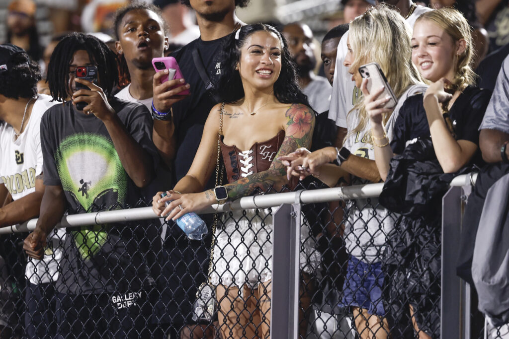 Leanna Lenee, fiancée of Defensive Back/Wide Receiver Travis Hunter #12 of the Colorado Buffaloes in the stands during the second half of the game against the UCF Knights at FBC Mortgage Stadium on September 28, 2024 in Orlando, Florida. The Buffaloes defeated the Knights 48 to 21.
